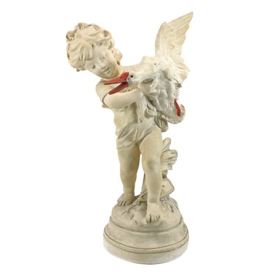 Lot 87 - A plaster figure of a boy with a goose.