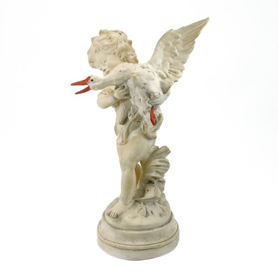 Lot 87 - A plaster figure of a boy with a goose.