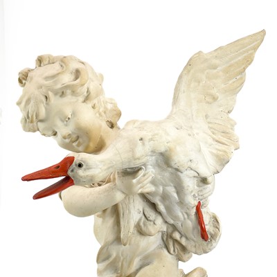 Lot 87 - A plaster figure of a boy with a goose.