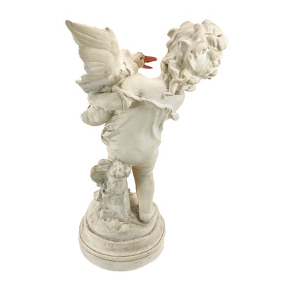 Lot 87 - A plaster figure of a boy with a goose.