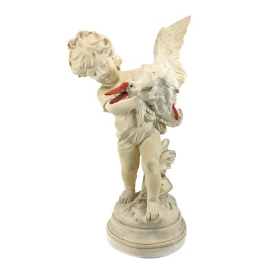 Lot 87 - A plaster figure of a boy with a goose.