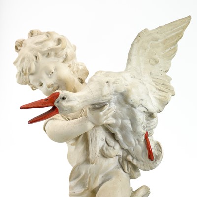 Lot 87 - A plaster figure of a boy with a goose.