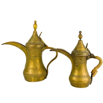 Lot 29 - Two Saudi Arabian brass dallah pots, 19th century.