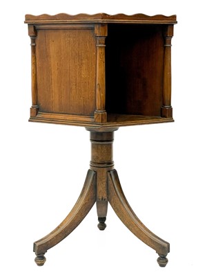 Lot 1870 - A 19th century mahogany hexagonal revolving bookcase on swept tripod supports.