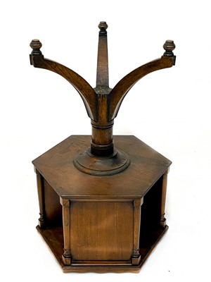 Lot 1870 - A 19th century mahogany hexagonal revolving bookcase on swept tripod supports.