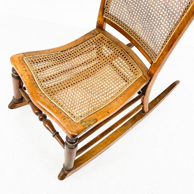 Lot 1890 - A late 19th century Bergere rocking chair.