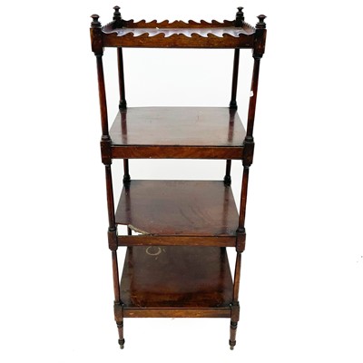 Lot 1915 - A late George III mahogany four tier whatnot.