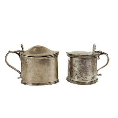 Lot 102 - Two silver mustard pots with blue glass liners