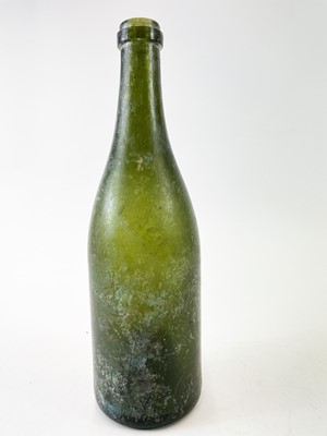 Lot 214 - A 19th century glass Champagne bottle.