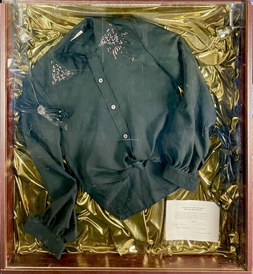 Lot 138 - A Billy Fury stage shirt in a display case.