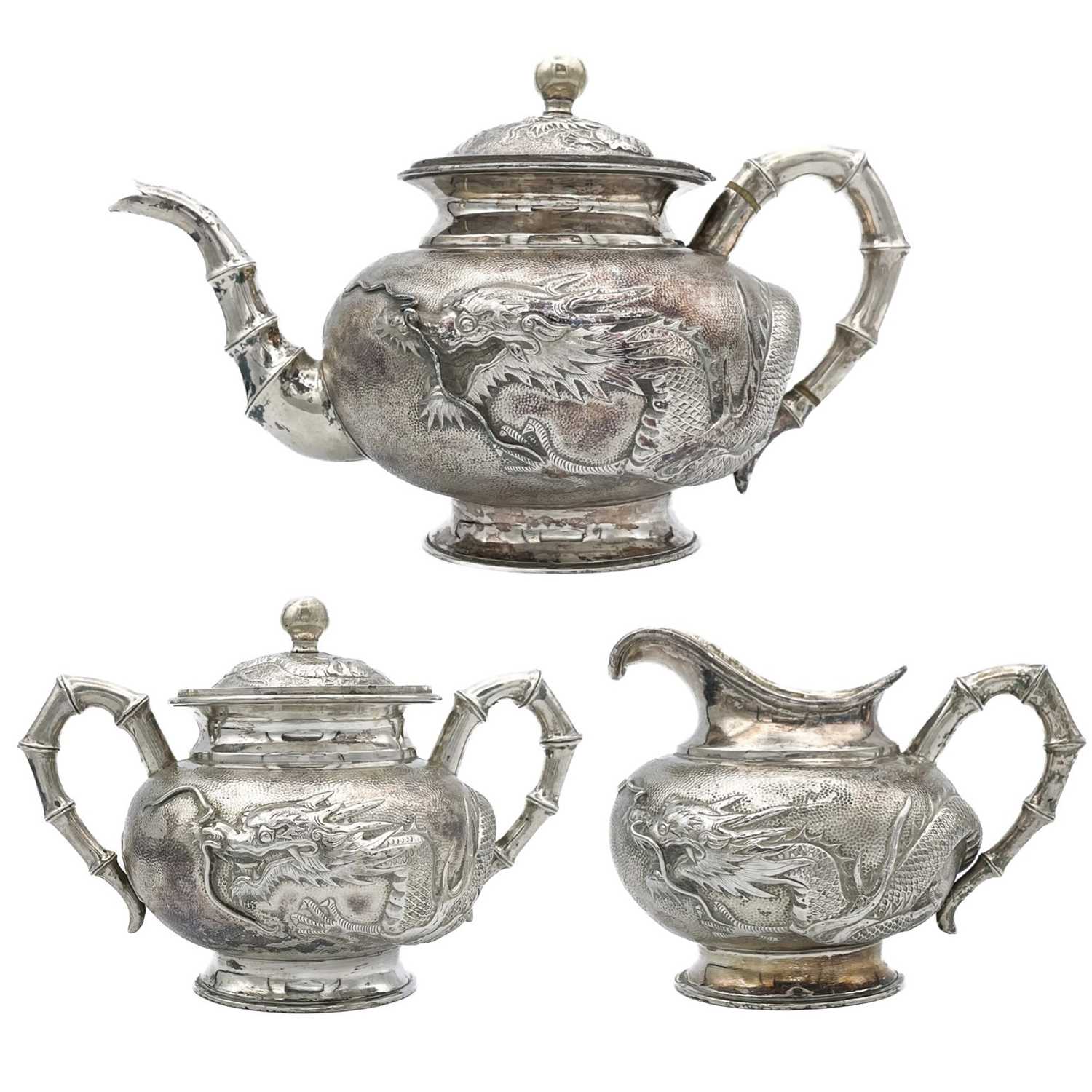 Lot 3 - A Chinese silver three-piece tea service, late 19th century.