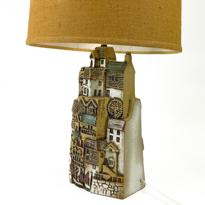 Lot 930 - A Tremaen pottery large village table lamp.