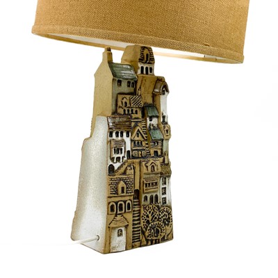 Lot 930 - A Tremaen pottery large village table lamp.