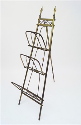 Lot 3498 - An Edwardian folding brass magazine rack, with...
