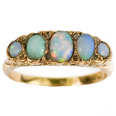 Lot 204 - An Edwardian 18ct gold opal set five stone ring.