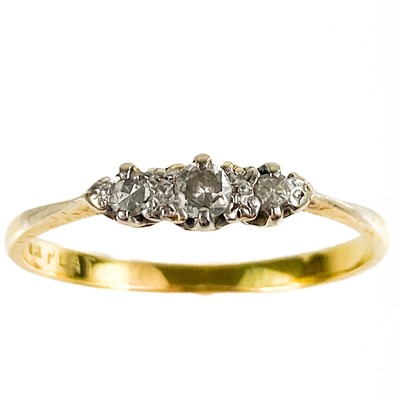 Lot 107 - An 18ct and platinum diamond set three stone ring.