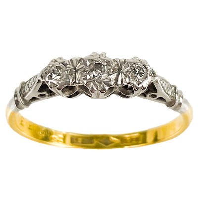 Lot 207 - An 18ct gold and platinum diamond set three stone ring.