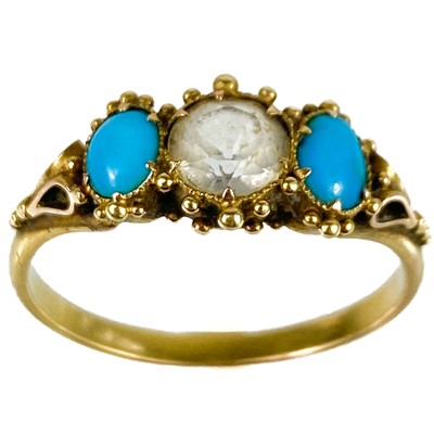 Lot 123 - A Victorian high purity gold turquoise and white stone set three stone ring.