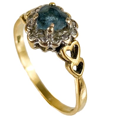 Lot 64 - A 9ct diamond and blue stone cluster heart shaped ring.