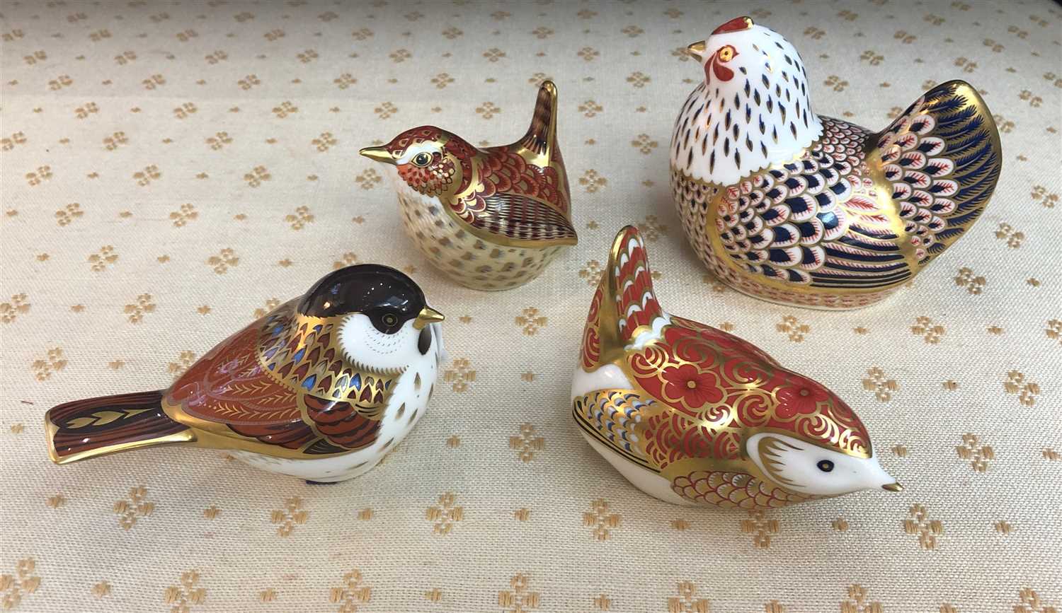 Lot 190 Four Royal Crown Derby paperweights.