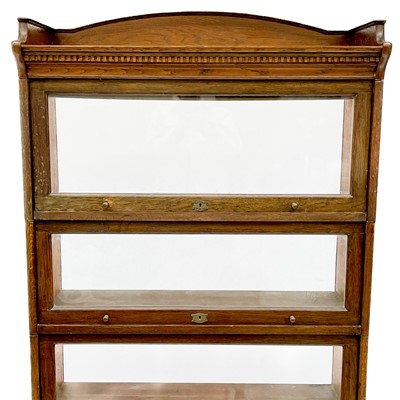 Lot 1903 - A Lebus oak sectional bookcase.