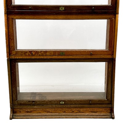 Lot 1903 - A Lebus oak sectional bookcase.
