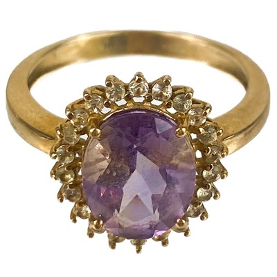 Lot 79 - A contemporary 9ct pale amethyst and white stone set cluster ring.