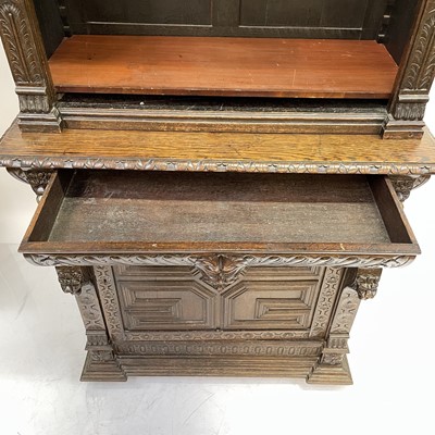 Lot 33 - A Victorian oak bookcase cabinet.