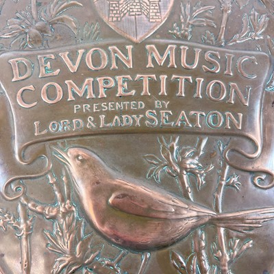 Lot 100 - A Newlyn copper trophy shield for the Devon Music Competition