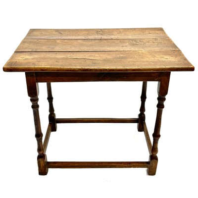 Lot 140 - An oak centre table.