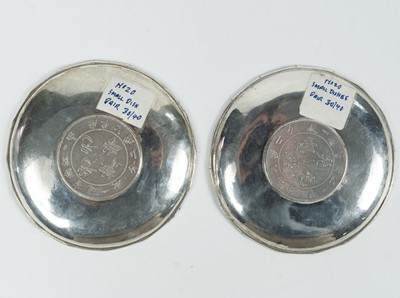 Lot 13 - Two Chinese silver circular dishes.