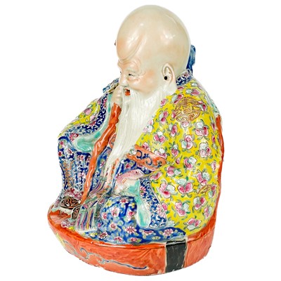 Lot 15 - A Chinese famille rose porcelain model of a seated Shoulao, 20th century.
