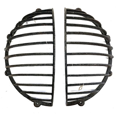 Lot 202 - A pair of wrought iron hay racks.