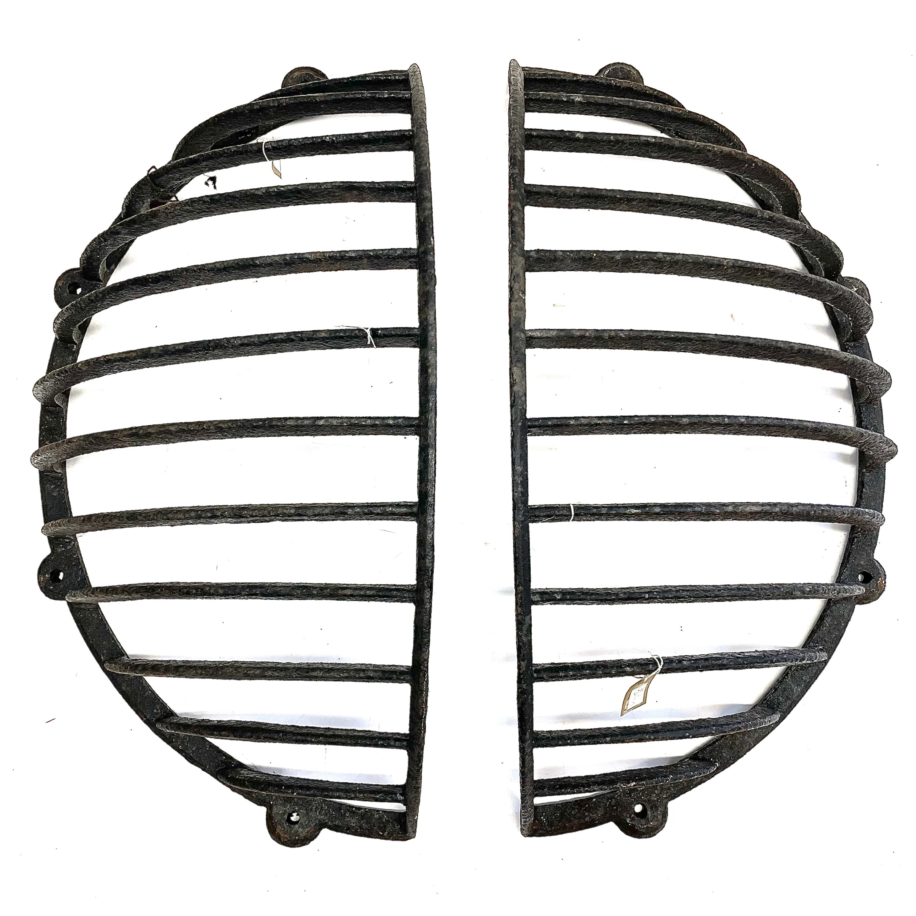 Lot 202 A pair of wrought iron hay racks.