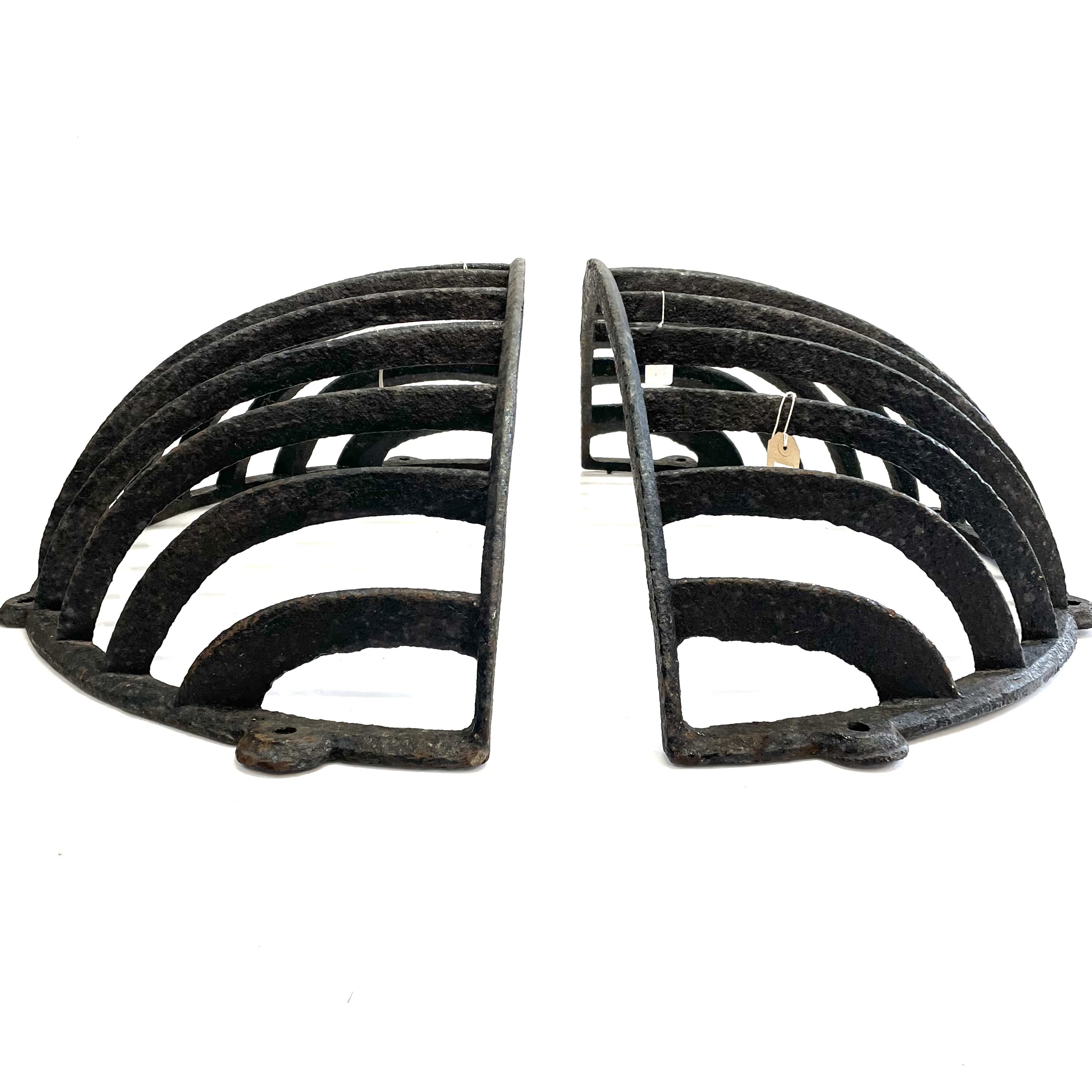 Lot 202 A pair of wrought iron hay racks.