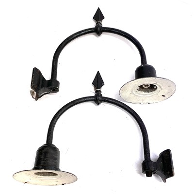 Lot 201 - A pair of wrought iron wall mounted street lanterns.