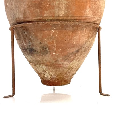 Lot 96 - A terracotta olive storage jar.