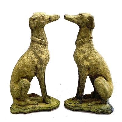 Lot 205 - A pair of reconstituted stone models of whippets.