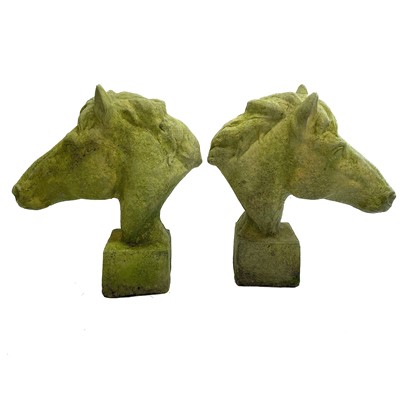 Lot 206 - A pair of reconstituted stone models of horse heads.