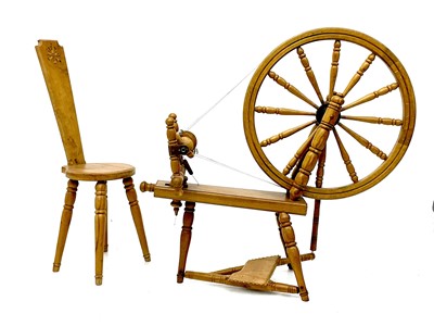 Lot 89 - An oak spinning wheel and chair.
