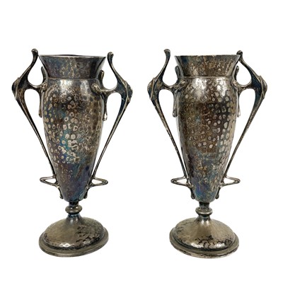 Lot 13 - A pair of Edwardian Arts and Crafts twin handled pedestal vases by H Greaves Ltd.