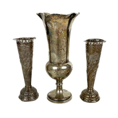 Lot 109 - An Edwardian silver fluted pedestal vase by William Comyns and Sons.