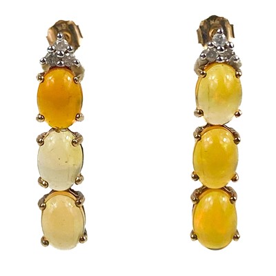 Lot 51 - A pair of 9ct Ethiopian opal and diamond set stud earrings.