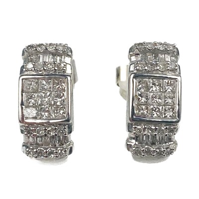 Lot 34 - A pair of 9ct white gold pavé diamond set panel stud earrings.