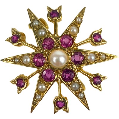 Lot 54 - An attractive 1960's 9ct gold, pearl and ruby set star brooch.