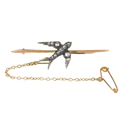 Lot 252 - An late Victorian rose gold diamond set Swallow bar brooch.