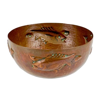 Lot 13 - A small Newlyn hammered copper bowl with repousse fish decoration.