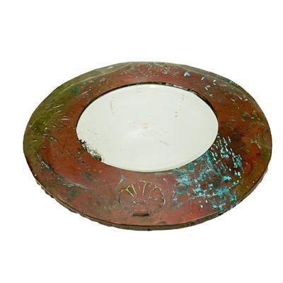 Lot 56 - An Arts and Crafts circular copper mirror.