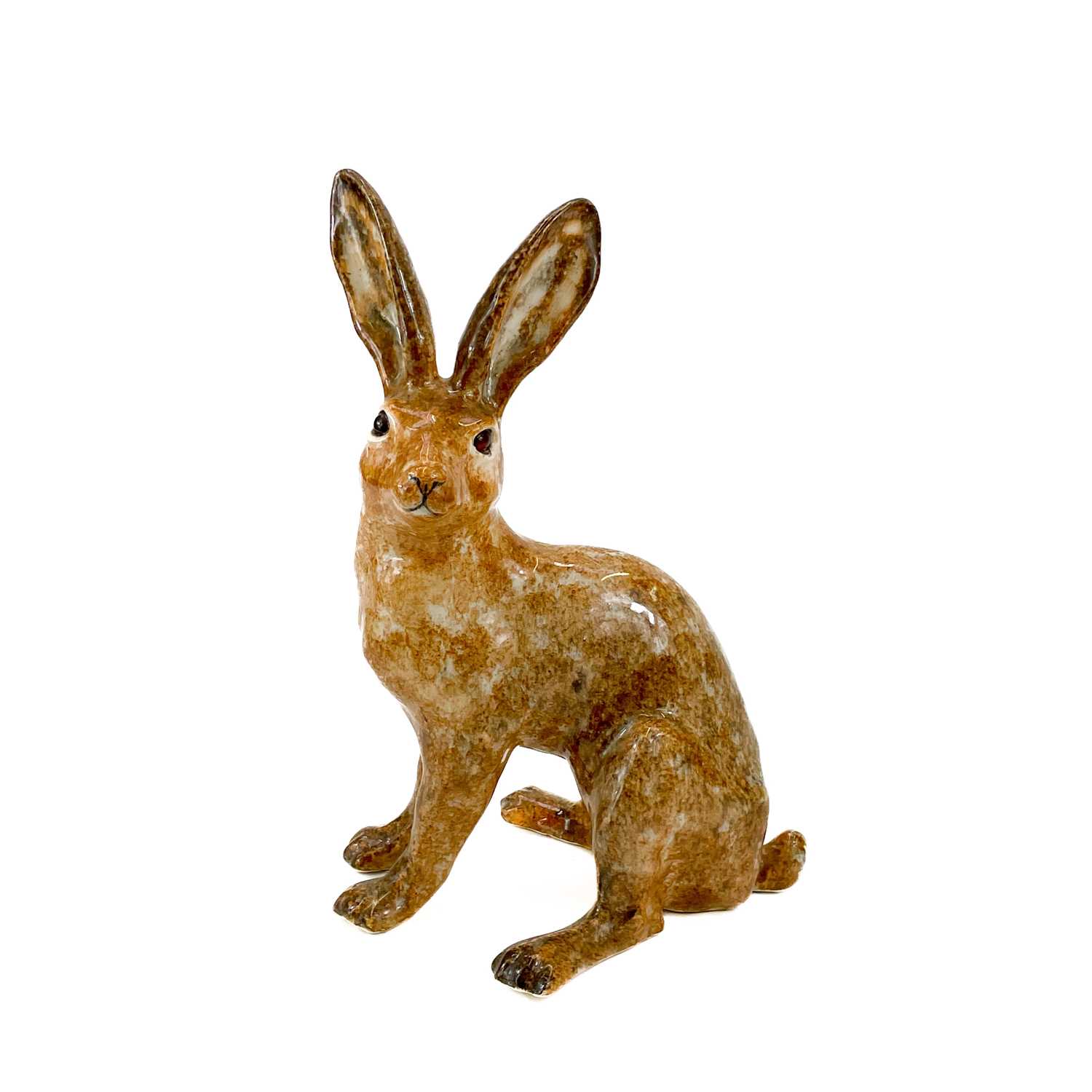 Lot 831 - A Winstanley Pottery model of a brown hare.