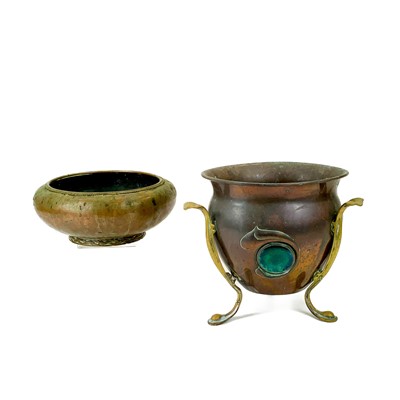 Lot 34 - An Arts and Crafts copper bowl by Dryad with rope twist rim and plaited foot to the base.